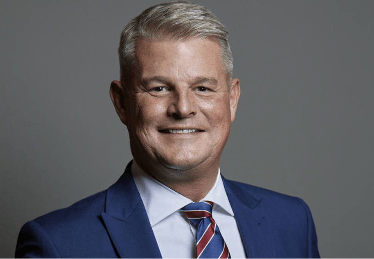 A profile picture of the Minister for Sport, Minster Stuart Andrew wearing a suit and tie