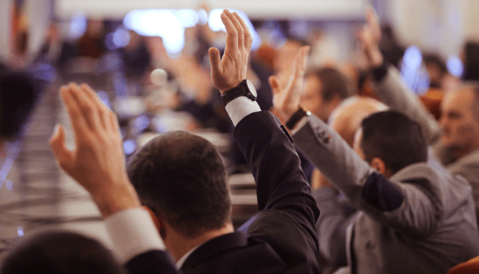 Political lobbying a group of people raising their hand